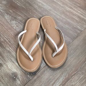 Beige patent leather thong